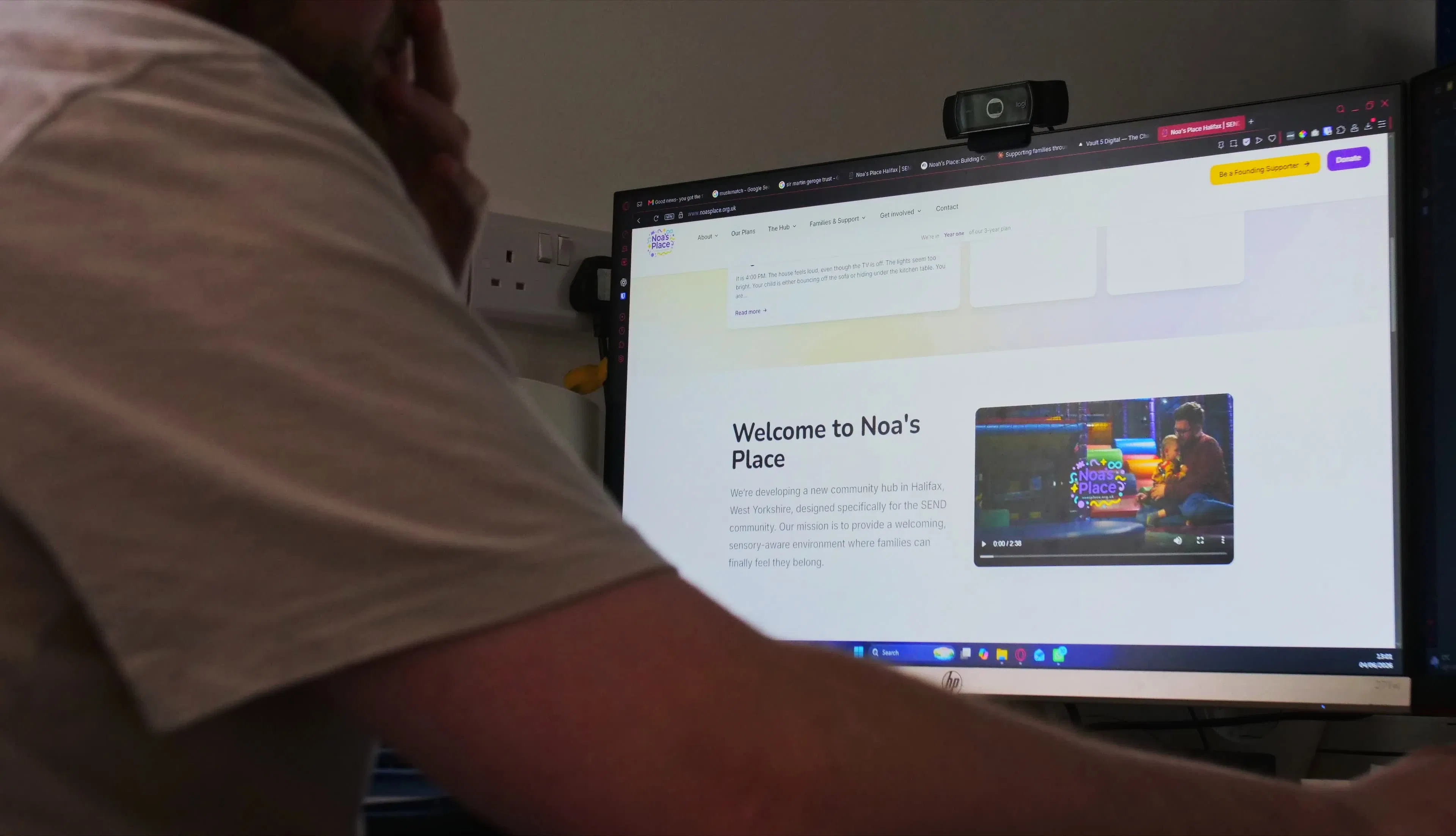 A Vault 5 team member reviews a charity website, focusing on clear calls to action and site structure.