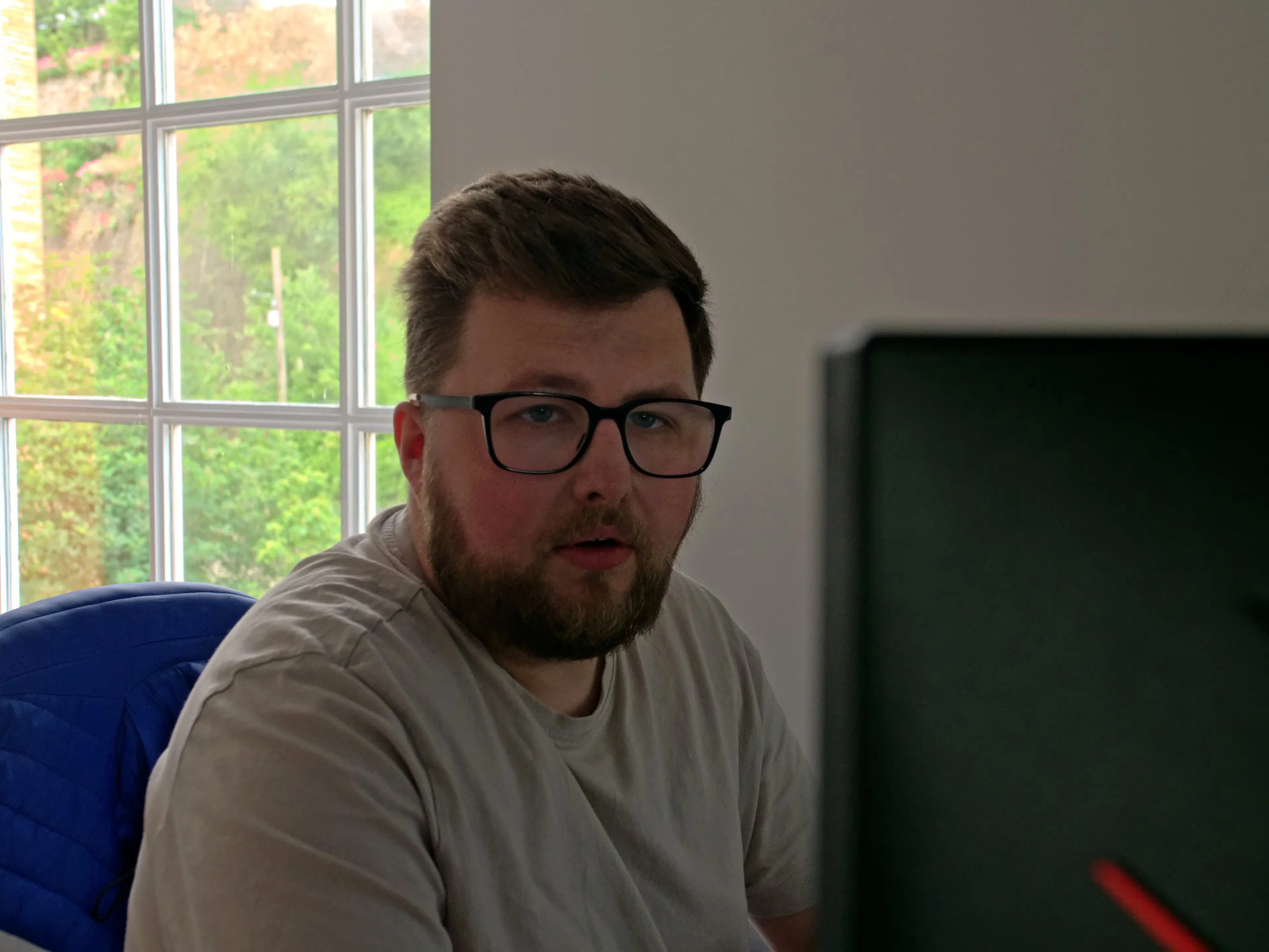 A professional team member working in a modern office, representing the expertise and human touch behind charity SEO.
