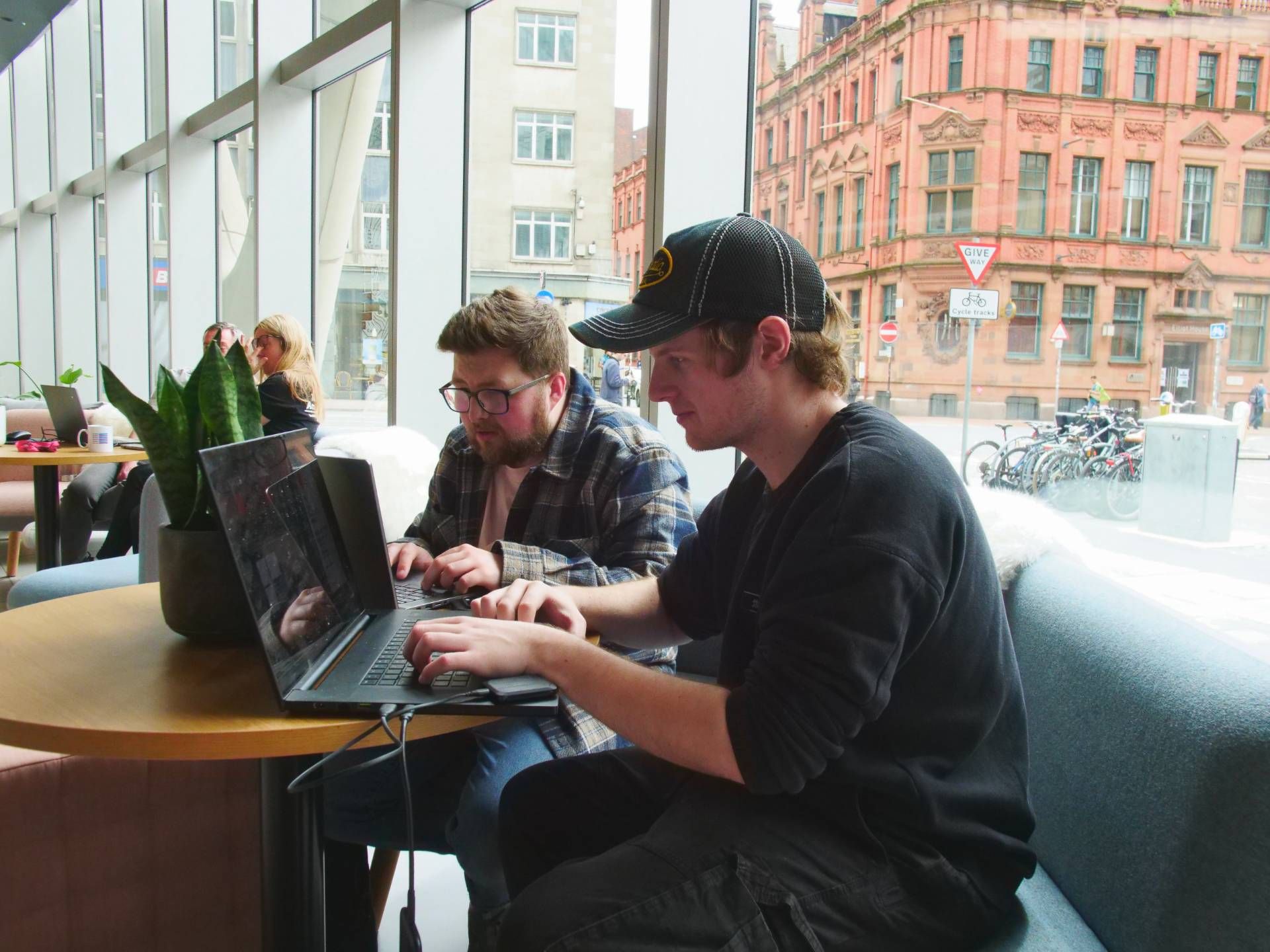 Vault 5 specialists working in a bright office on website development and digital strategy
