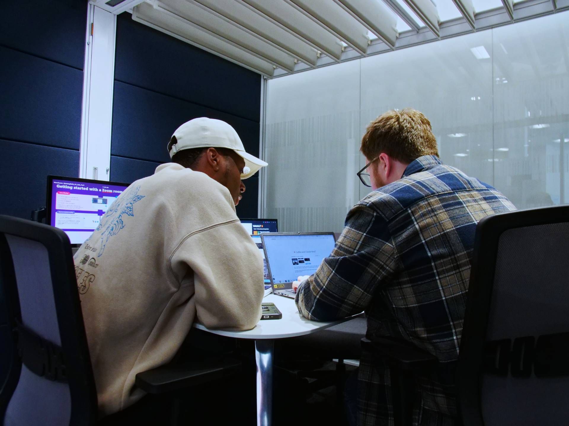 Vault 5 digital team members working side by side on strategy and creative planning for charity campaigns.