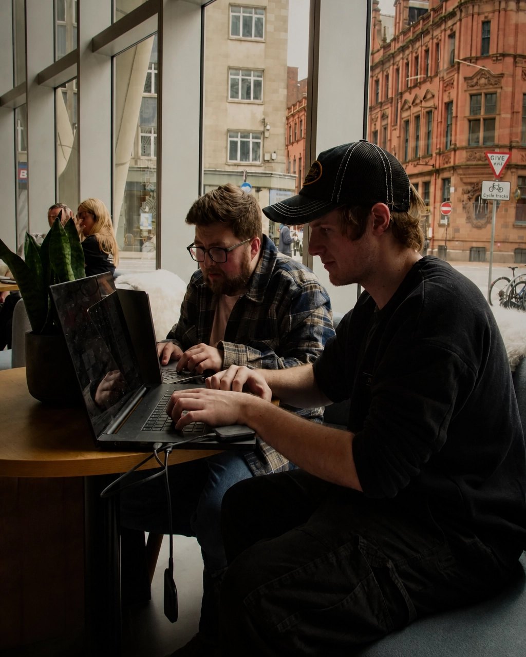 Vault 5 team members reviewing charity marketing strategy and campaign performance together