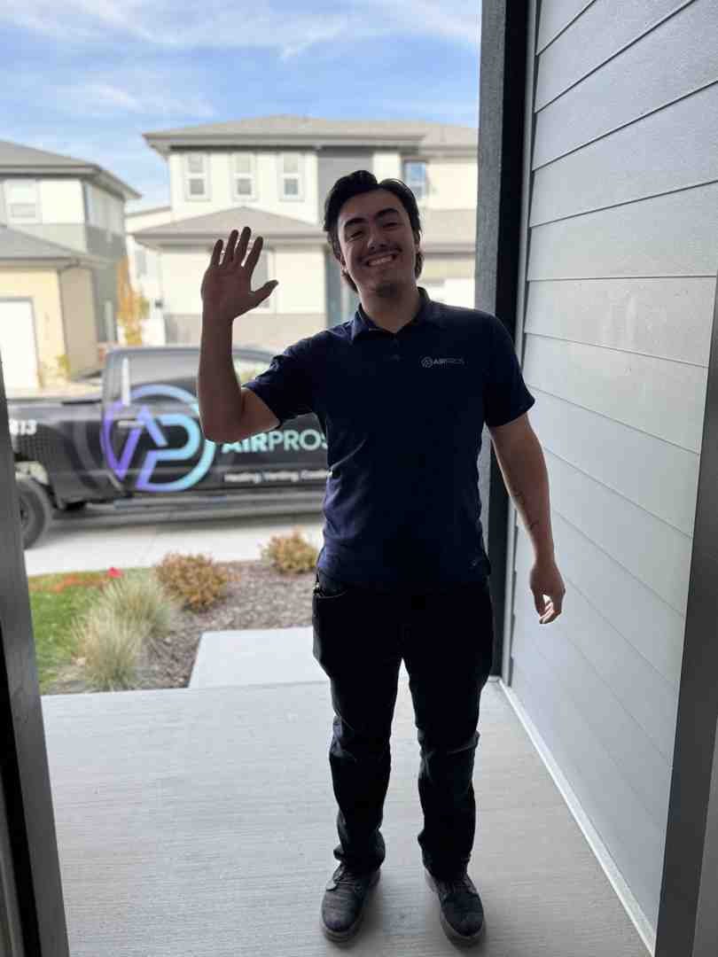 Homeowner and technician handshake - affordable HVAC maintenance