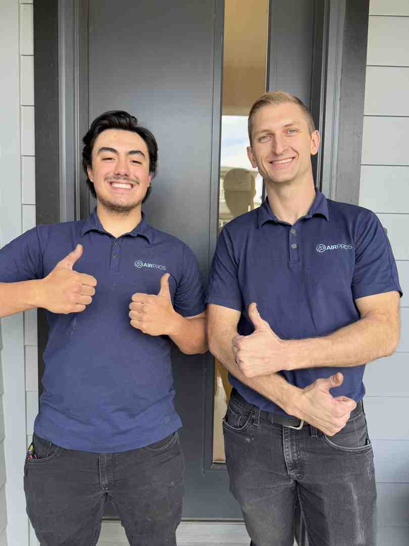 a friendly Air Pros technician smiling - home air conditioner