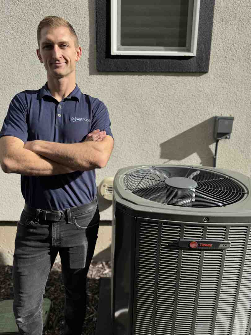 HVAC technician performing load calculation in home - Energy-saving HVAC solutions