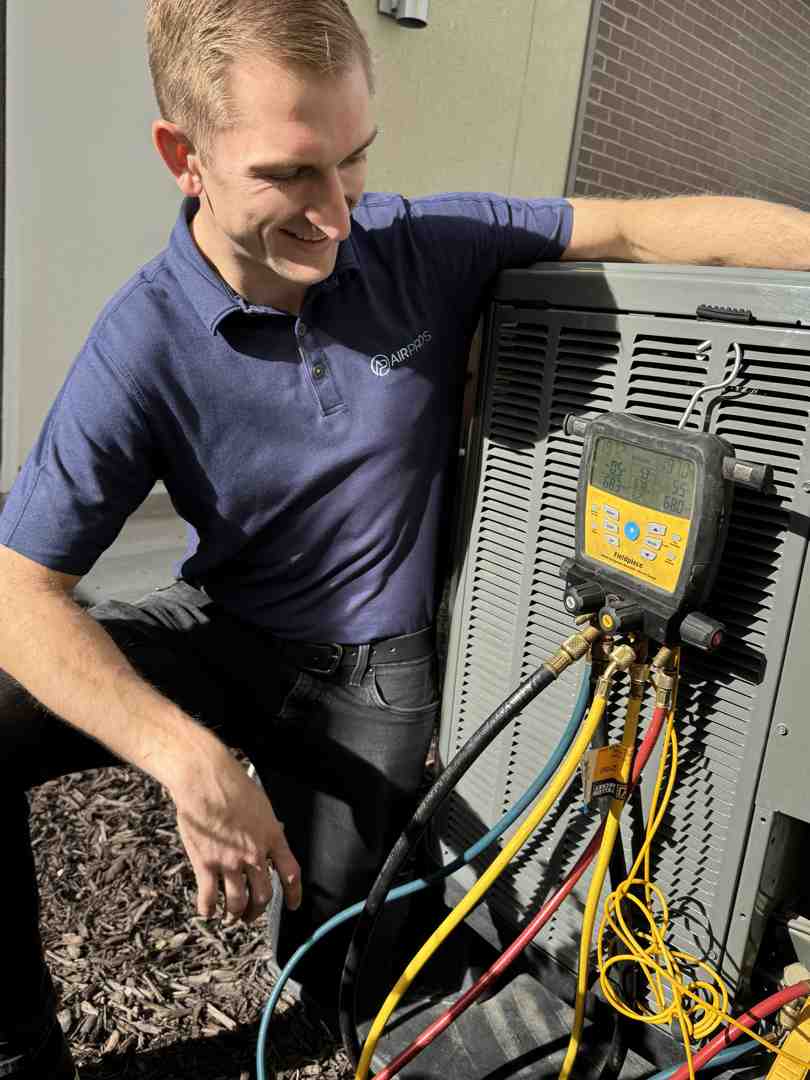 HVAC technician performing system maintenance - Energy-saving HVAC solutions