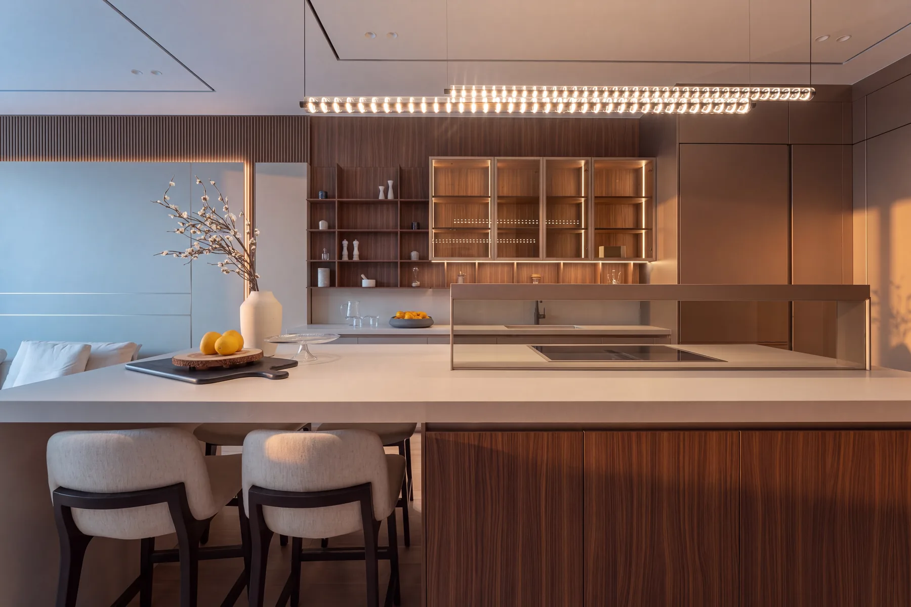 A working kitchen of a dual-kitchen arrangement, walnut and stone