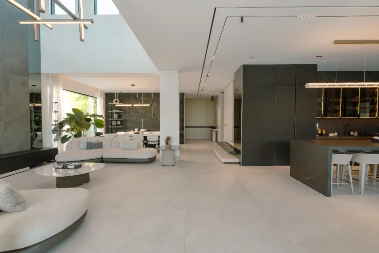 A completed kitchen — stone, joinery and lit shelving