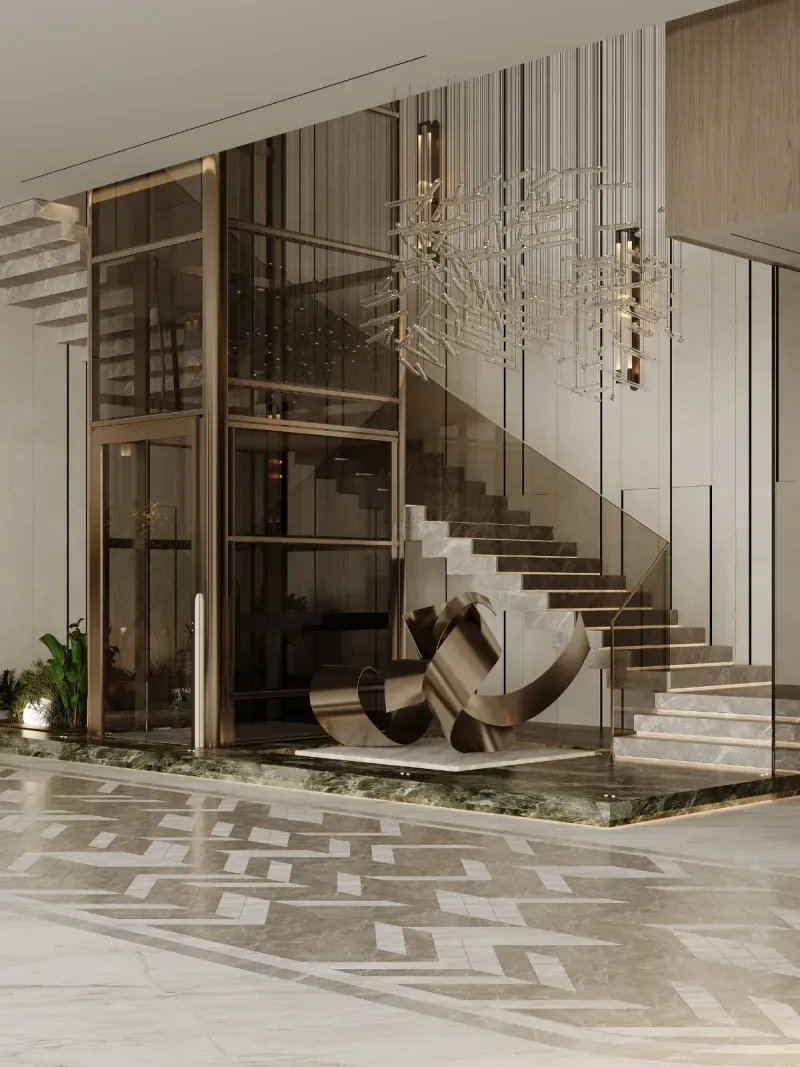The entrance hall of a DMDC house — a cantilevered stone stair, glazed lift shaft, bronze sculpture and inlaid marble floor
