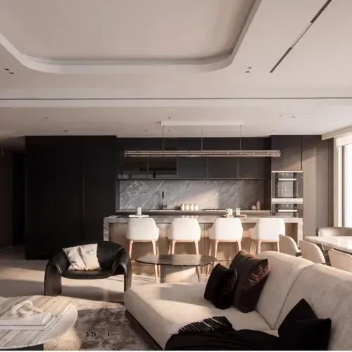 An open-plan living and kitchen space with dark cabinetry and a marble backsplash