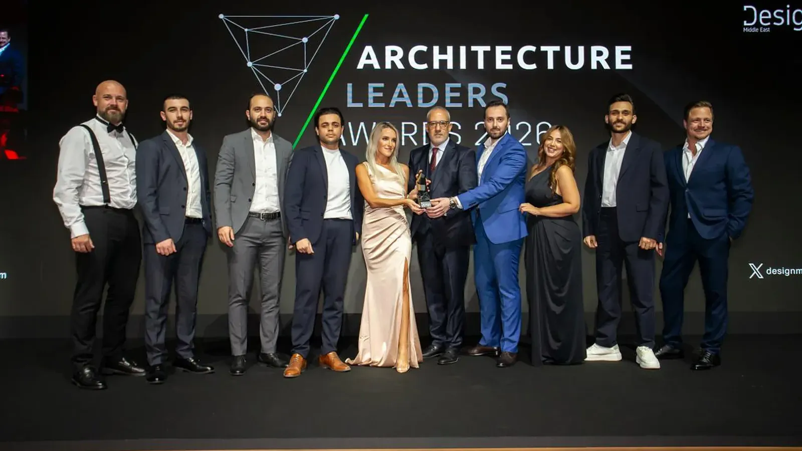 The DMDC team on stage receiving Design and Build Project of the Year at the Architecture Leaders Awards 2026