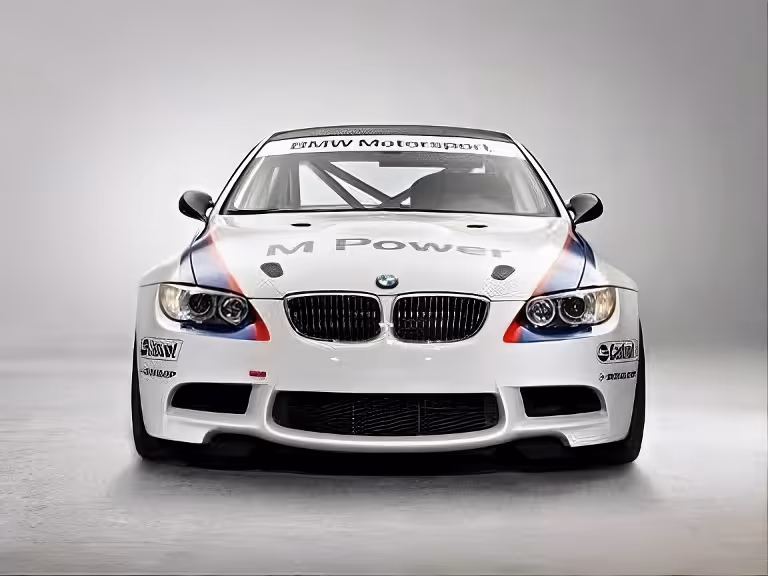 Front view of white BMW Motorsport race car with M Power logo and racing decals.