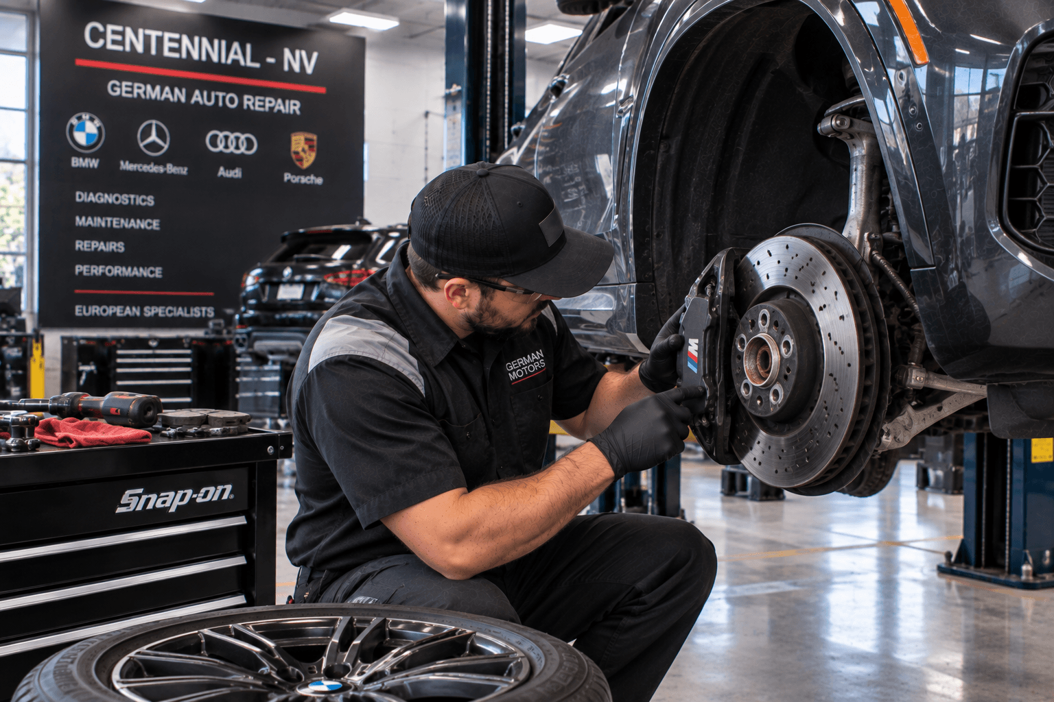 German Auto Repair in Centennial - NV technician checking brake components on a European SUV