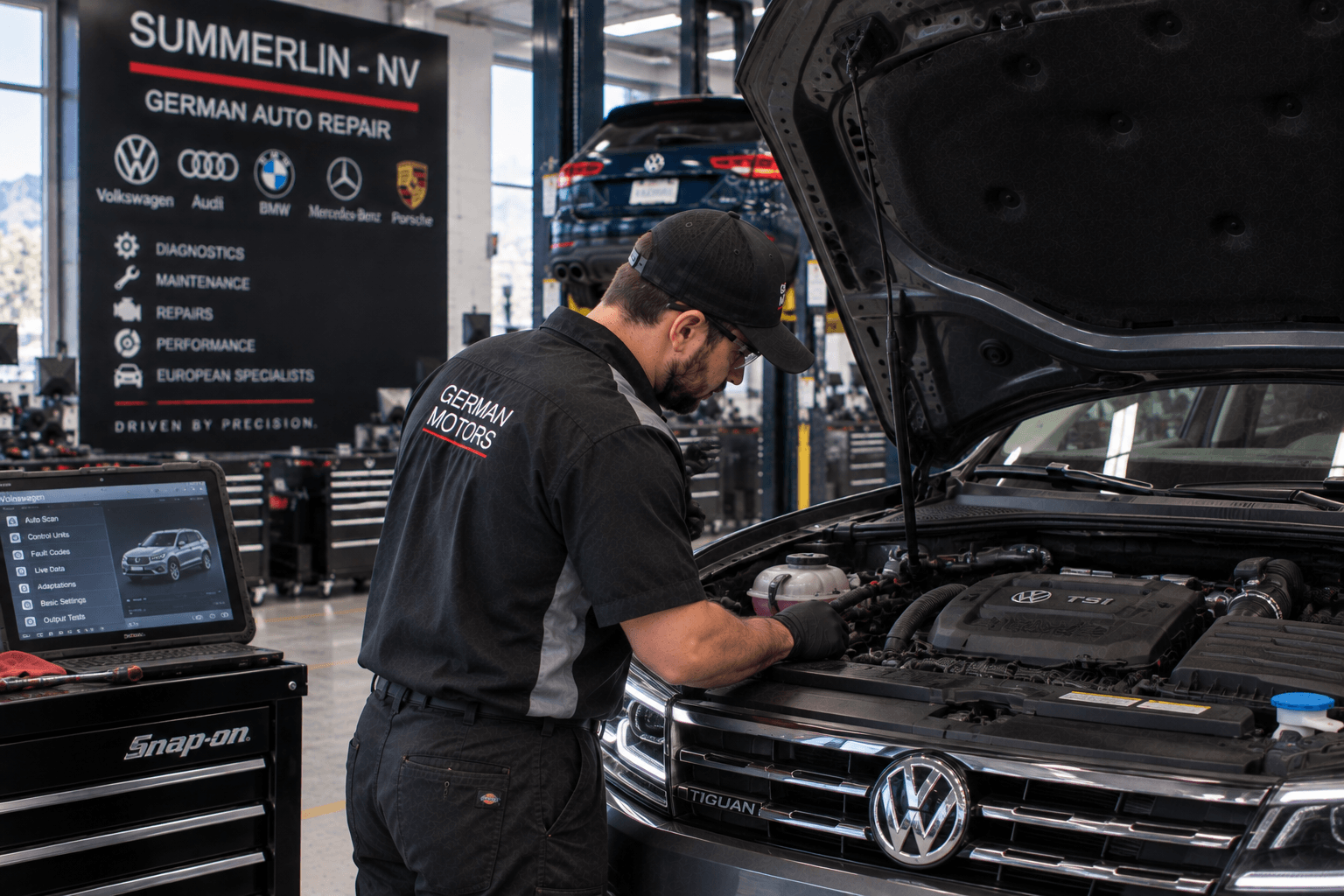 Volkswagen Repair in Summerlin - NV technician inspecting a Tiguan engine bay during service