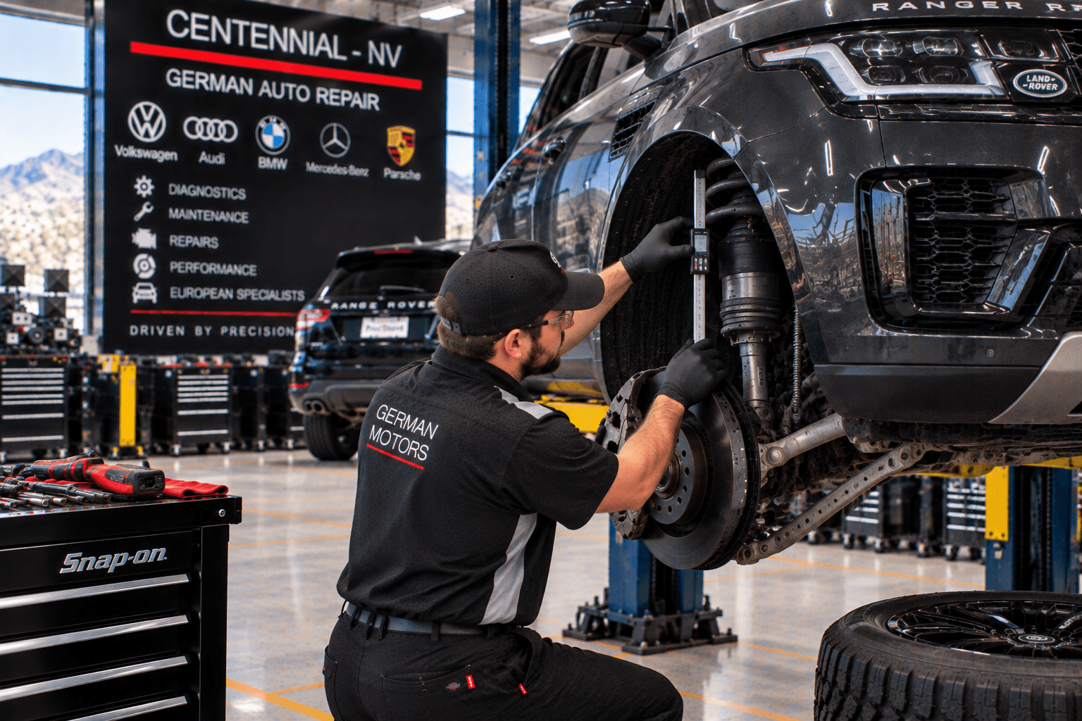 Land Rover Repair in Centennial - NV technician checking suspension height on a luxury SUV