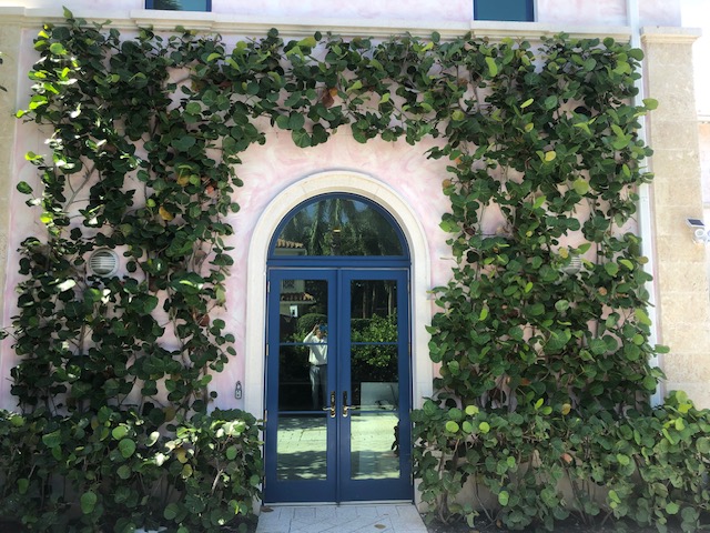 Florida Son Landscaping crew member maintaining a South Florida estate property