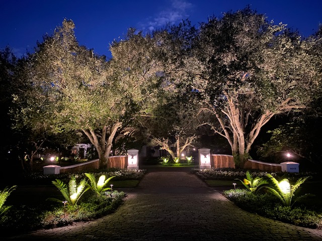 Florida Son Landscaping crew member maintaining a South Florida estate property