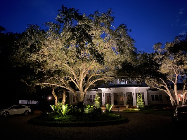Florida Son Landscaping crew member maintaining a South Florida estate property