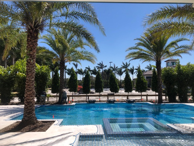 Florida Son Landscaping crew maintaining a South Florida estate lawn