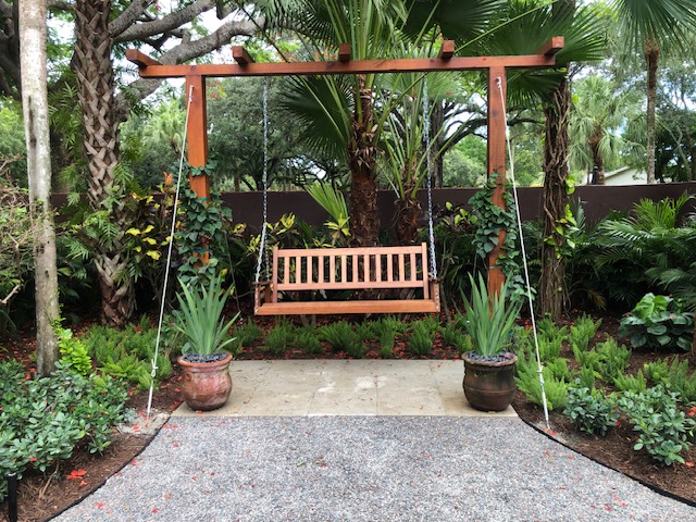 Florida Son Landscaping crew maintaining a South Florida estate lawn