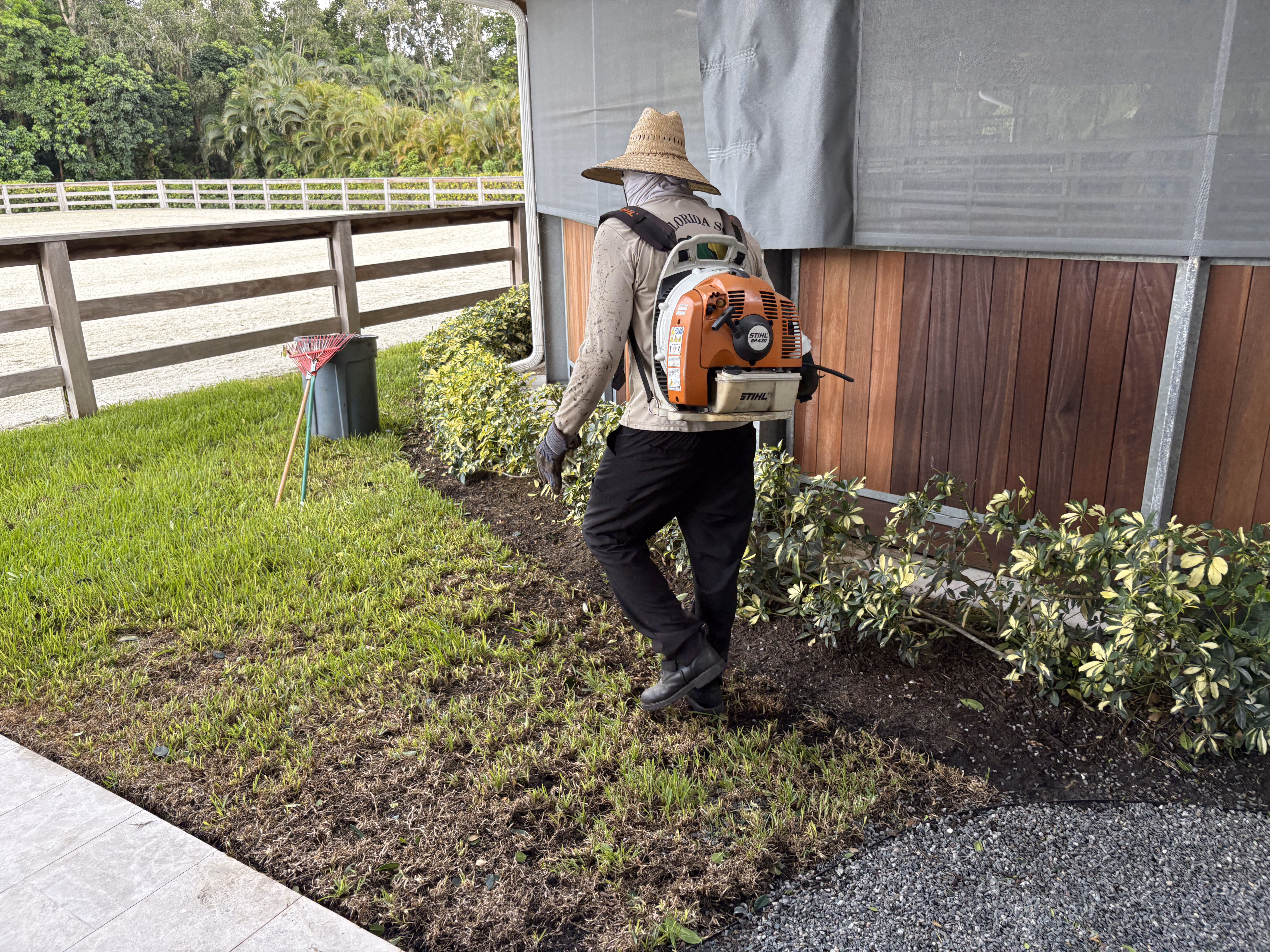 Equestrian property fence line and turf maintained by Florida Son Landscaping