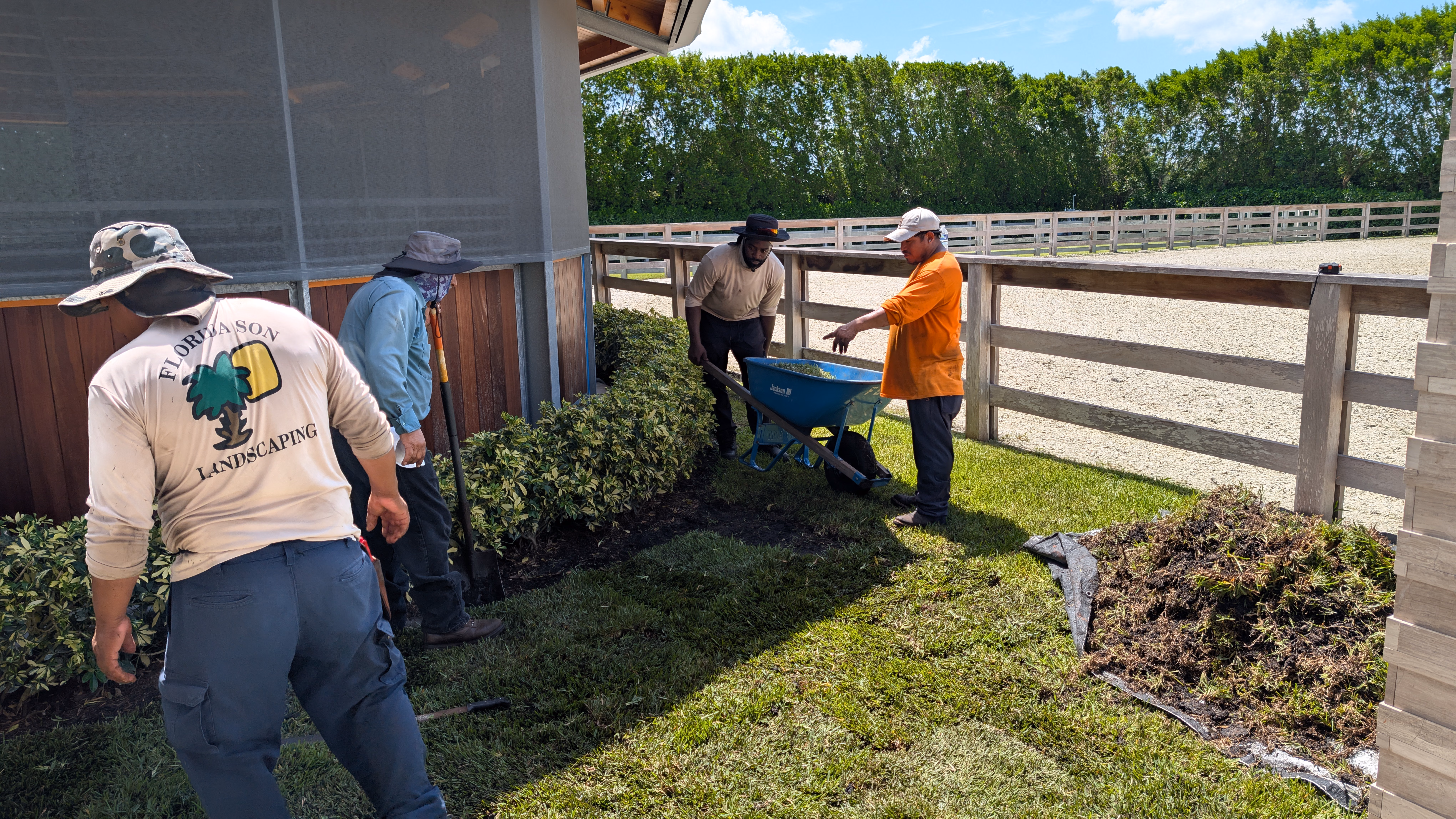 Florida Son Landscaping crew member maintaining a South Florida estate property