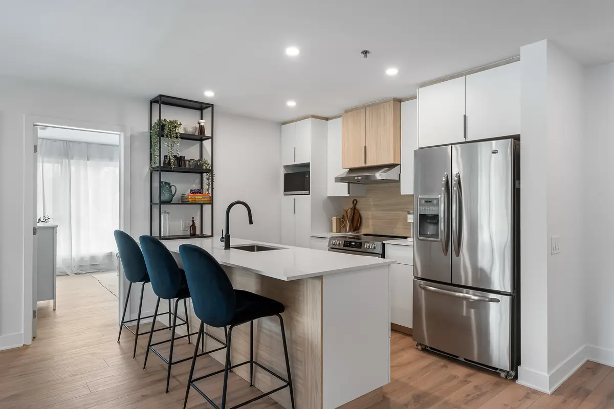 Cuisine ouverte et salle à manger d'un appartement 4½ à louer à L'Épiphanie