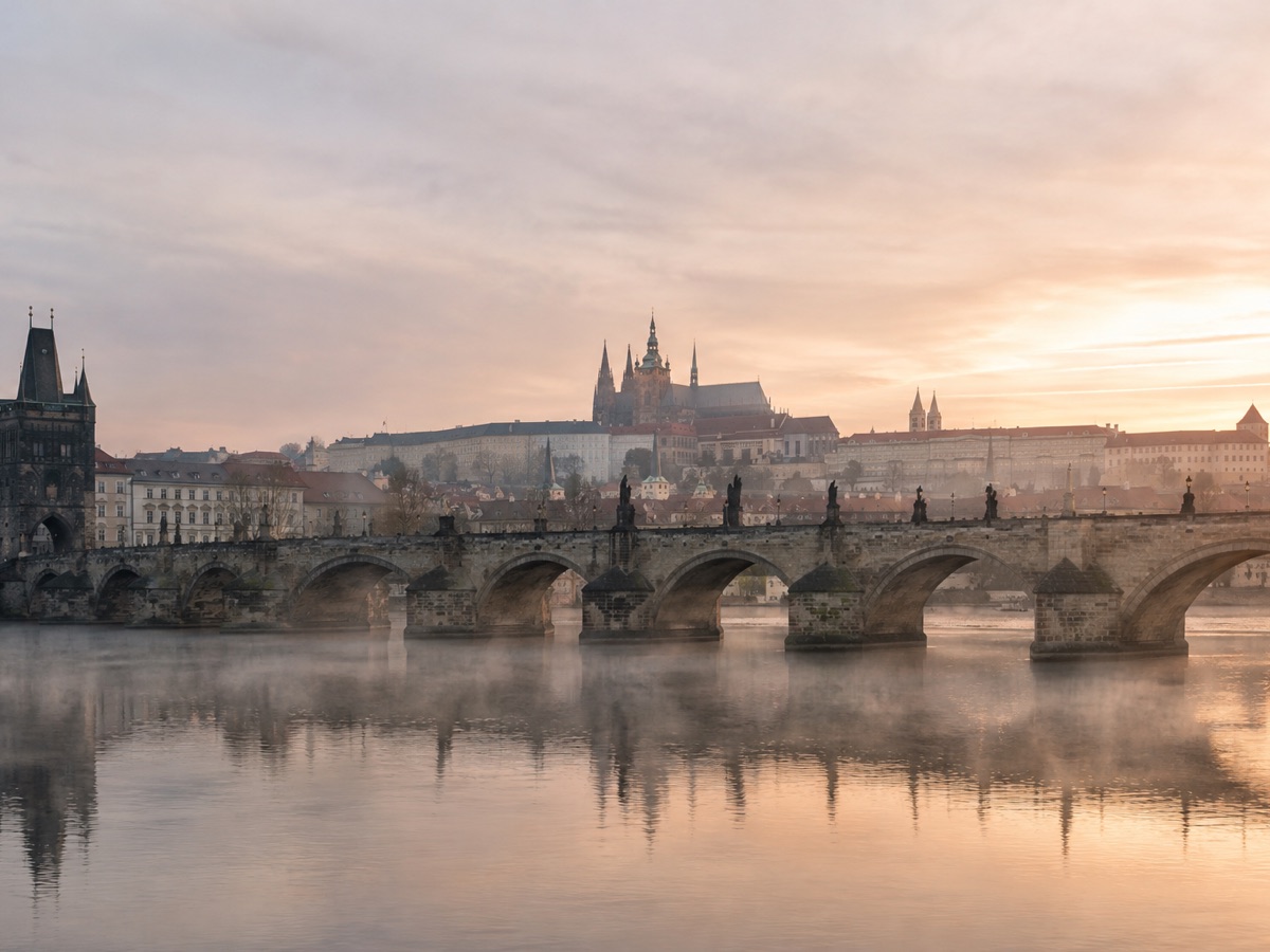 Charles Bridge and Prague Castle across the Vltava River at sunrise