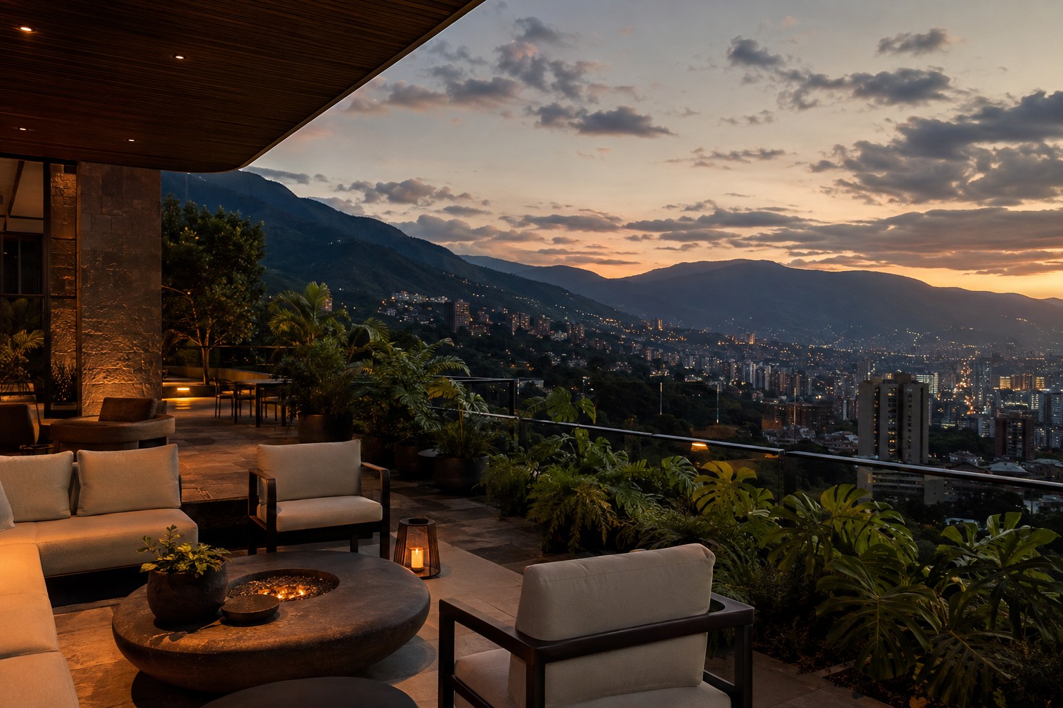 Green Andean ridges rising above the Medellin valley with the city spread below at dusk