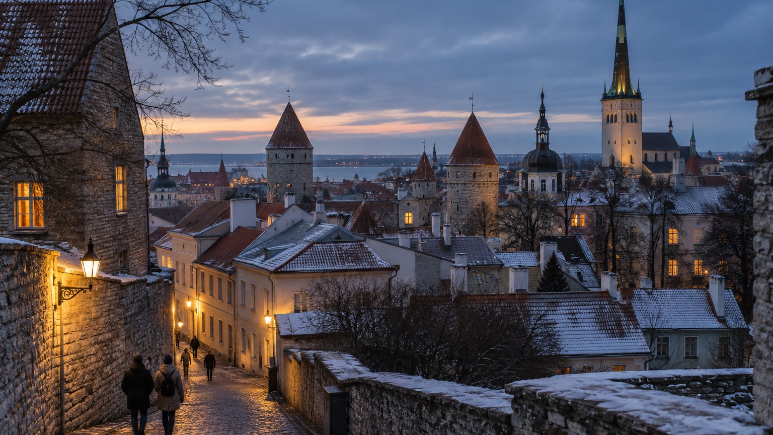 Tallinn medieval old town rooftops and warm winter windows at dusk