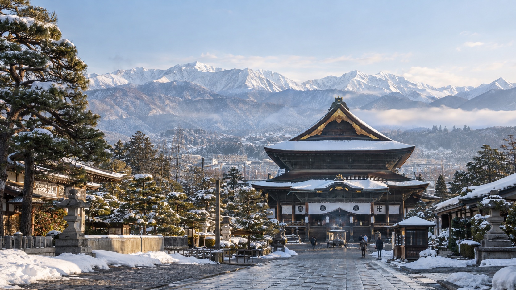 Zenkoji Temple in snowy Nagano with the Japanese Alps behind it