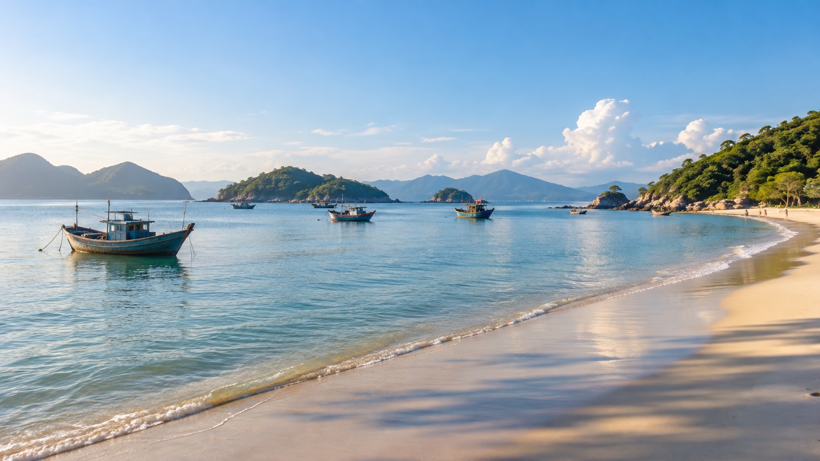Nha Trang bay at sunrise with fishing boats, beach, and green islands