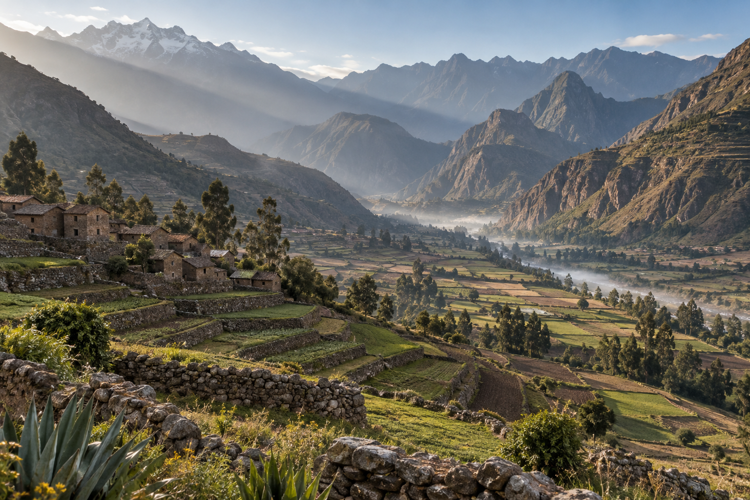 Terraced fields and high Andes peaks in Peru's Sacred Valley at dawn