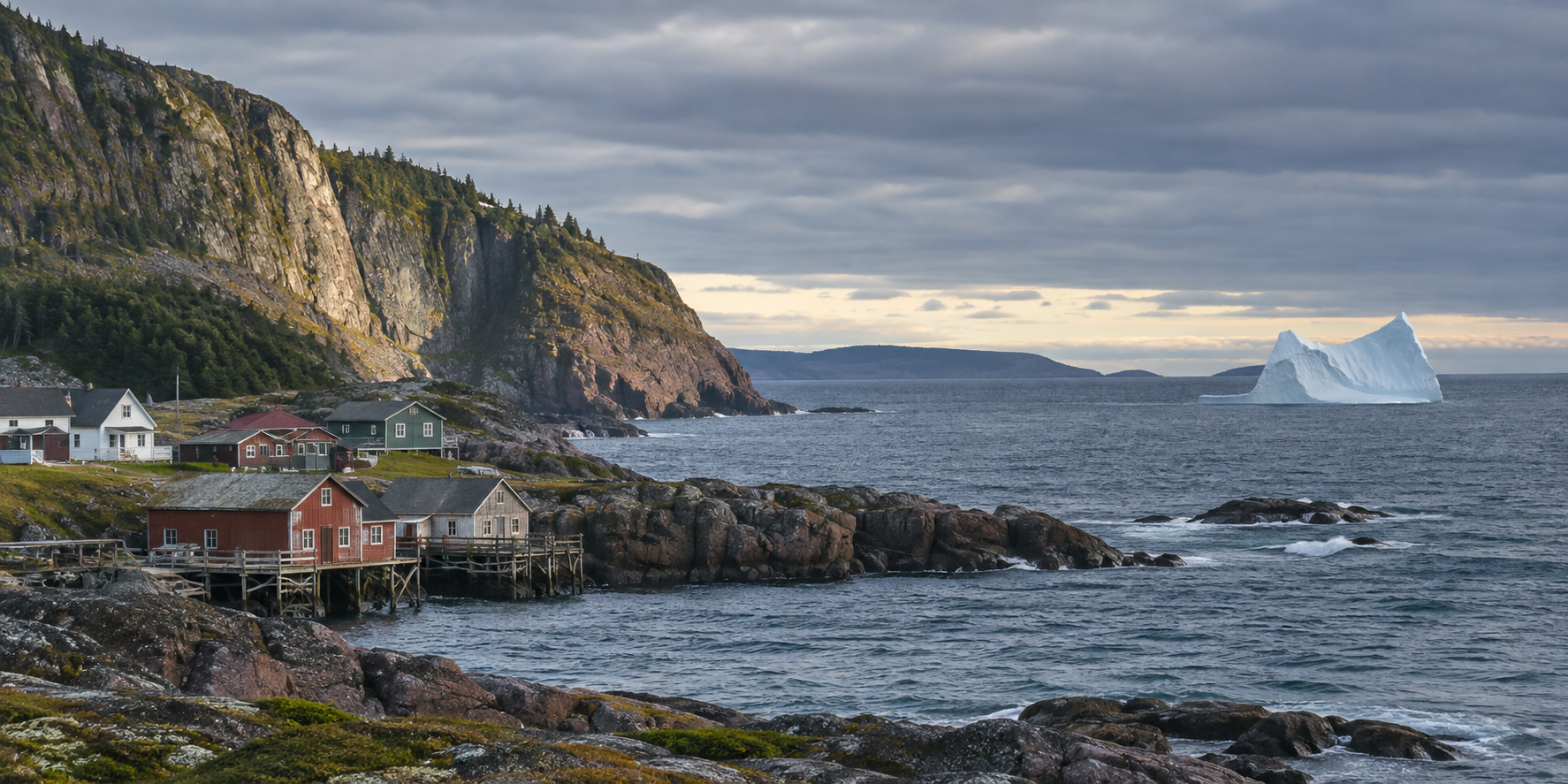 Weathered fishing village beside a rocky Atlantic coast and a distant iceberg in Newfoundland