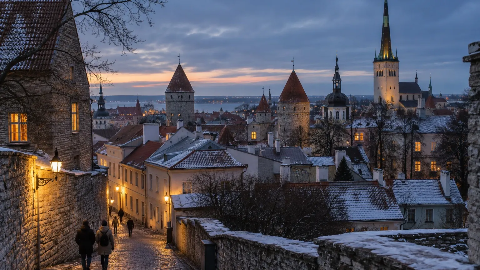 Tallinn medieval old town rooftops and warm winter windows at dusk