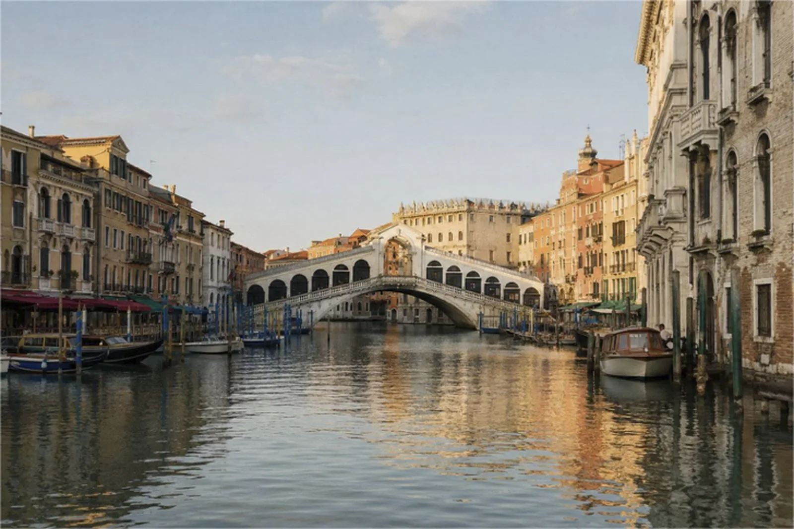 Venetian canal and palazzo facades at first light