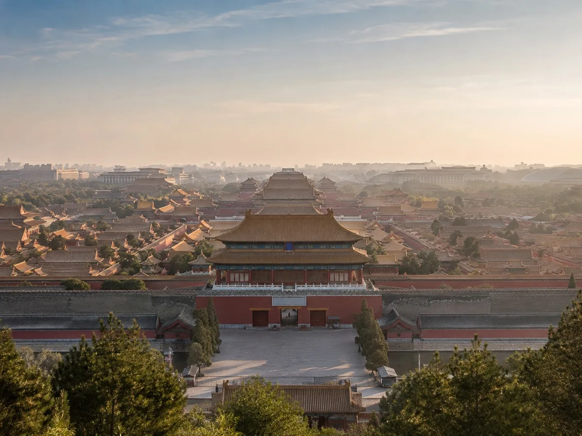 The Forbidden City in Beijing viewed across layered palace rooftops at golden hour