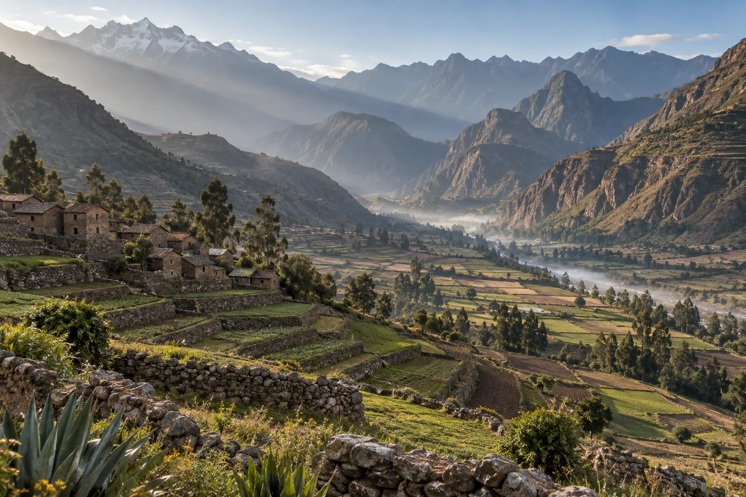 Terraced fields and high Andes peaks in Peru's Sacred Valley at dawn