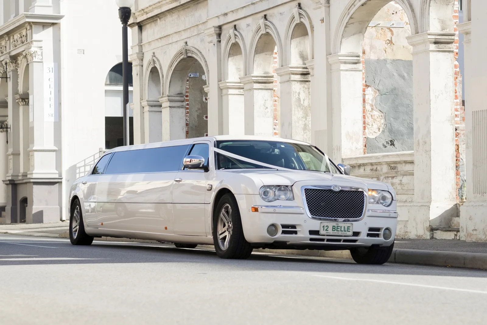 White Chrysler stretch limousine with chauffeur, Perth