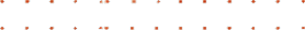 Repeated pattern of four red hearts evenly spaced on a black background.