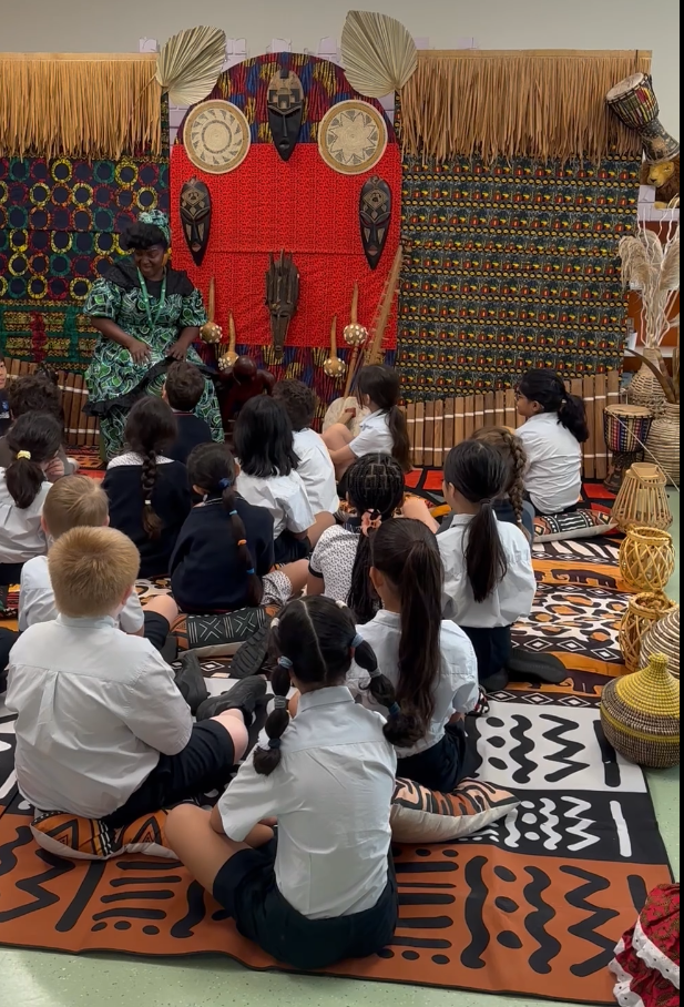 Students engaging with African culture through an immersive educational experience