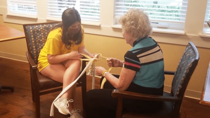 Harvester Place Residents and Summer Campers Bring Joy to Dogs in Shelters