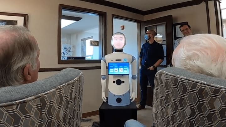 Highline Place Memory Care Residents Test Drive “Ryan” the Robot