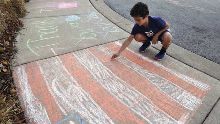 Students “Chalk the Walk” in Honor of Veterans at Grace Point Place