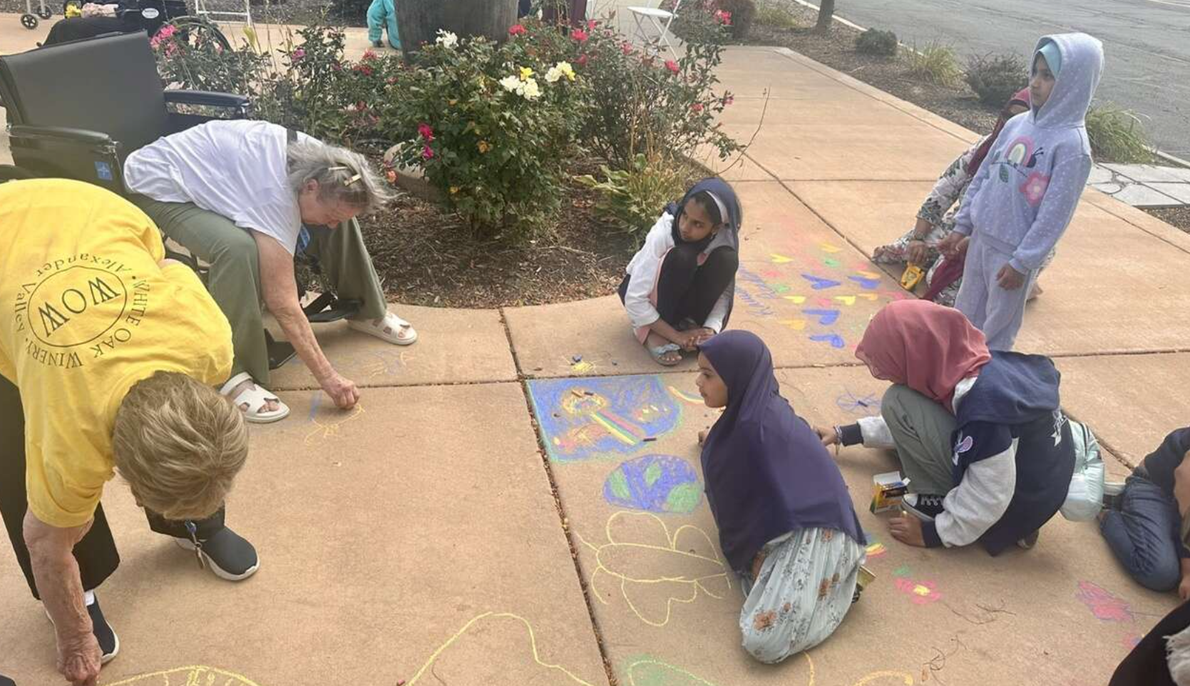 Students Bring Sidewalk Art and Smiles to Churchill Place