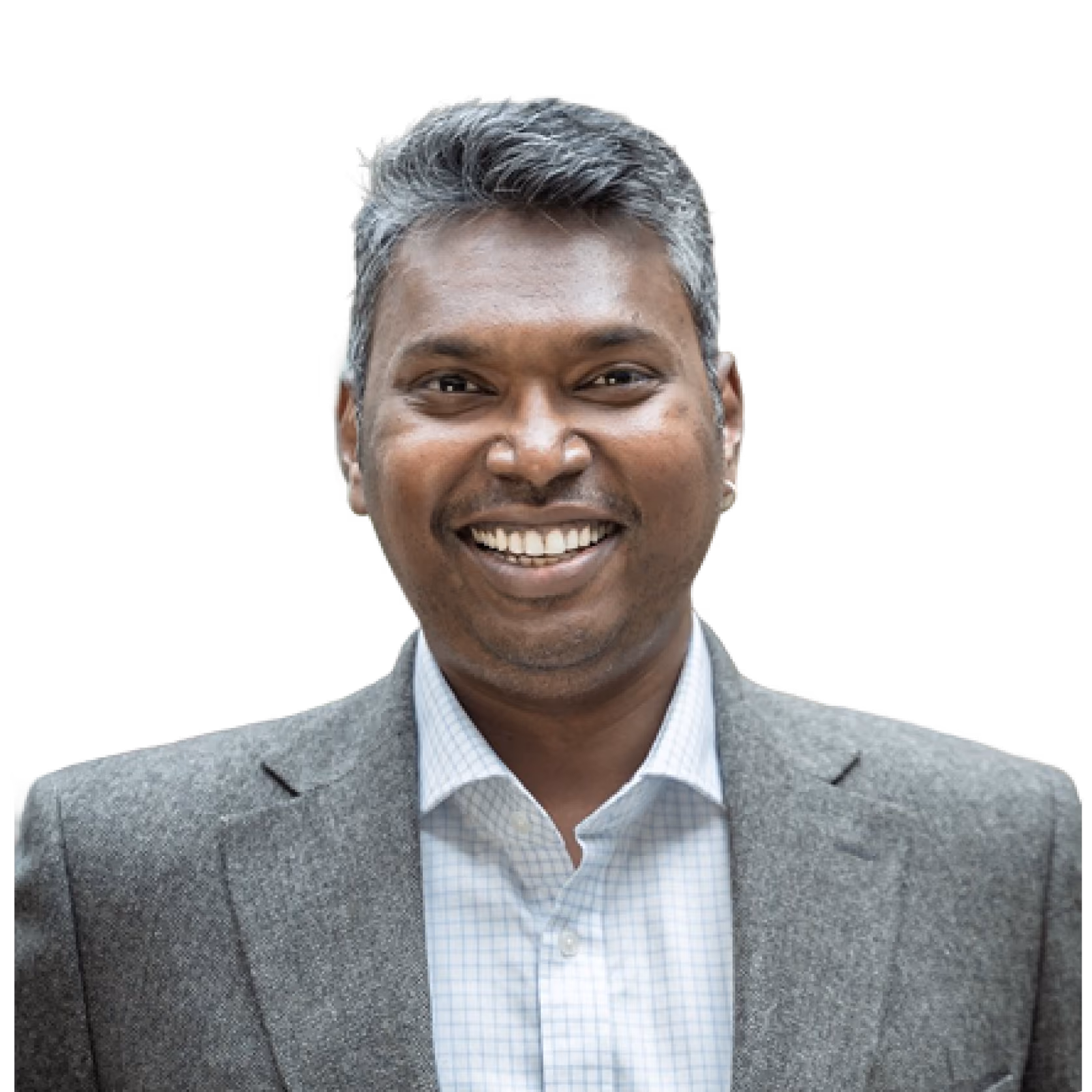 Smiling man with gray hair wearing a gray blazer and white checkered shirt on black background.