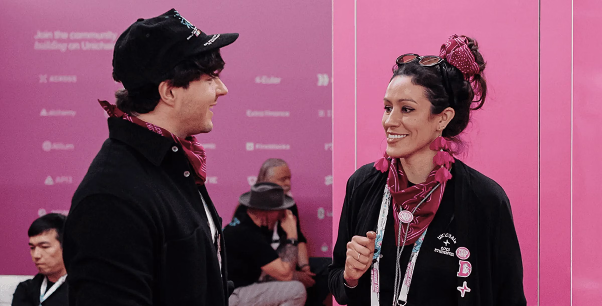 Bull Moose and Uniswap team members talking at a conference