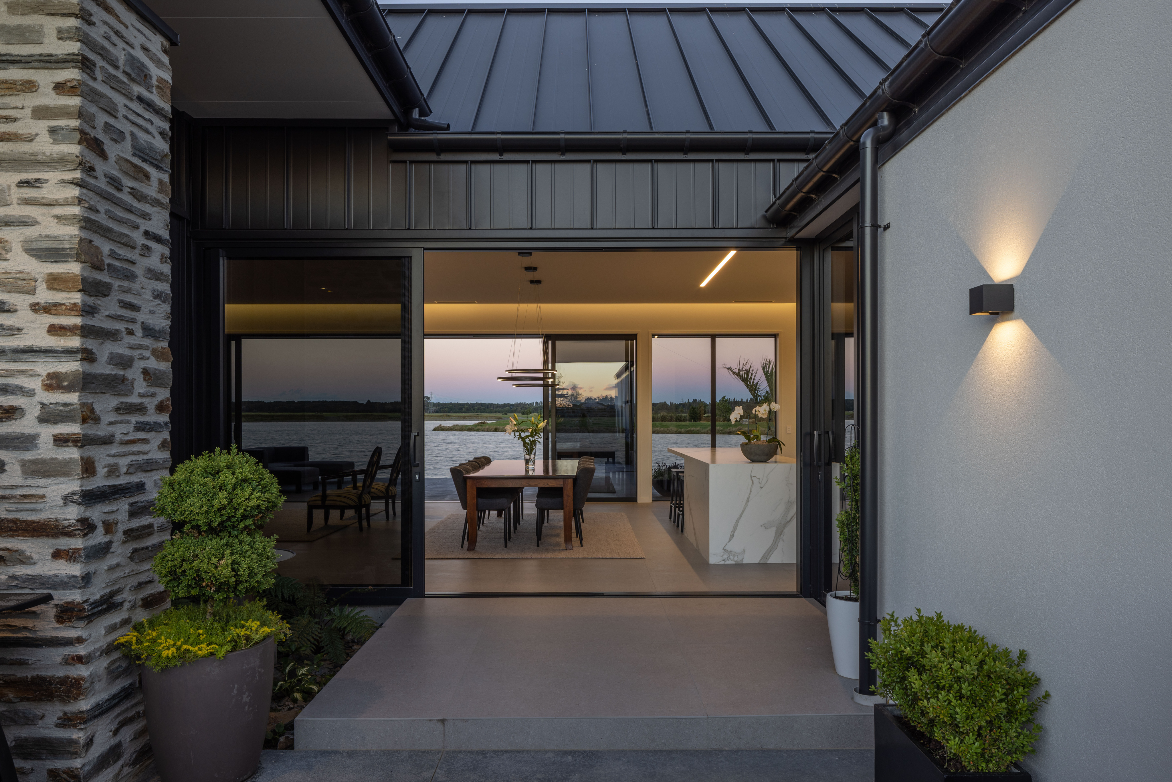 Modern architectural home with outdoor living area built to last by Millar Construction
