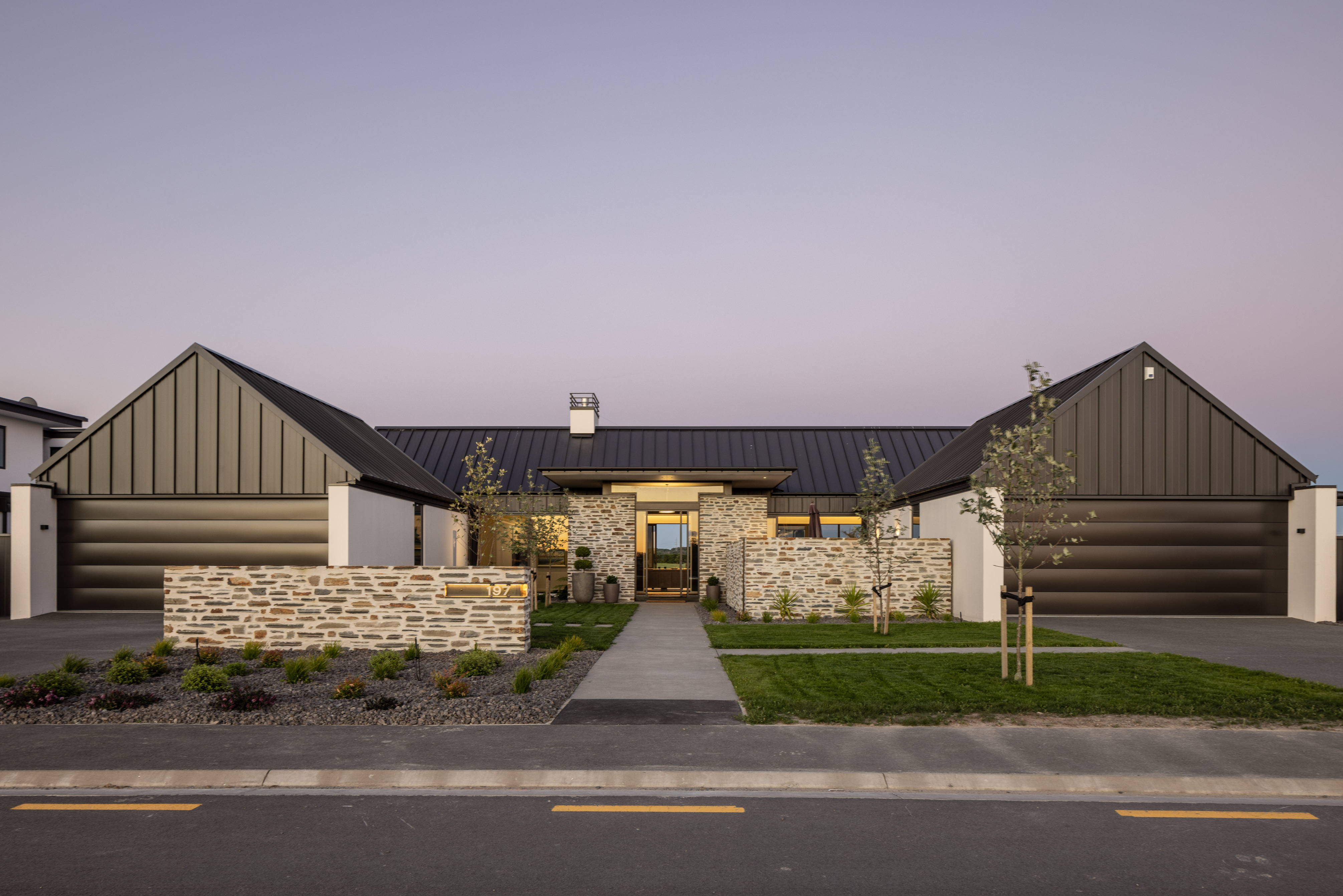 Modern architectural home with outdoor living area built to last by Millar Construction