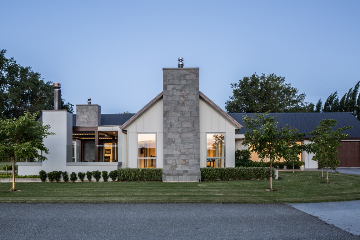 Modern architectural home with outdoor living area built to last by Millar Construction