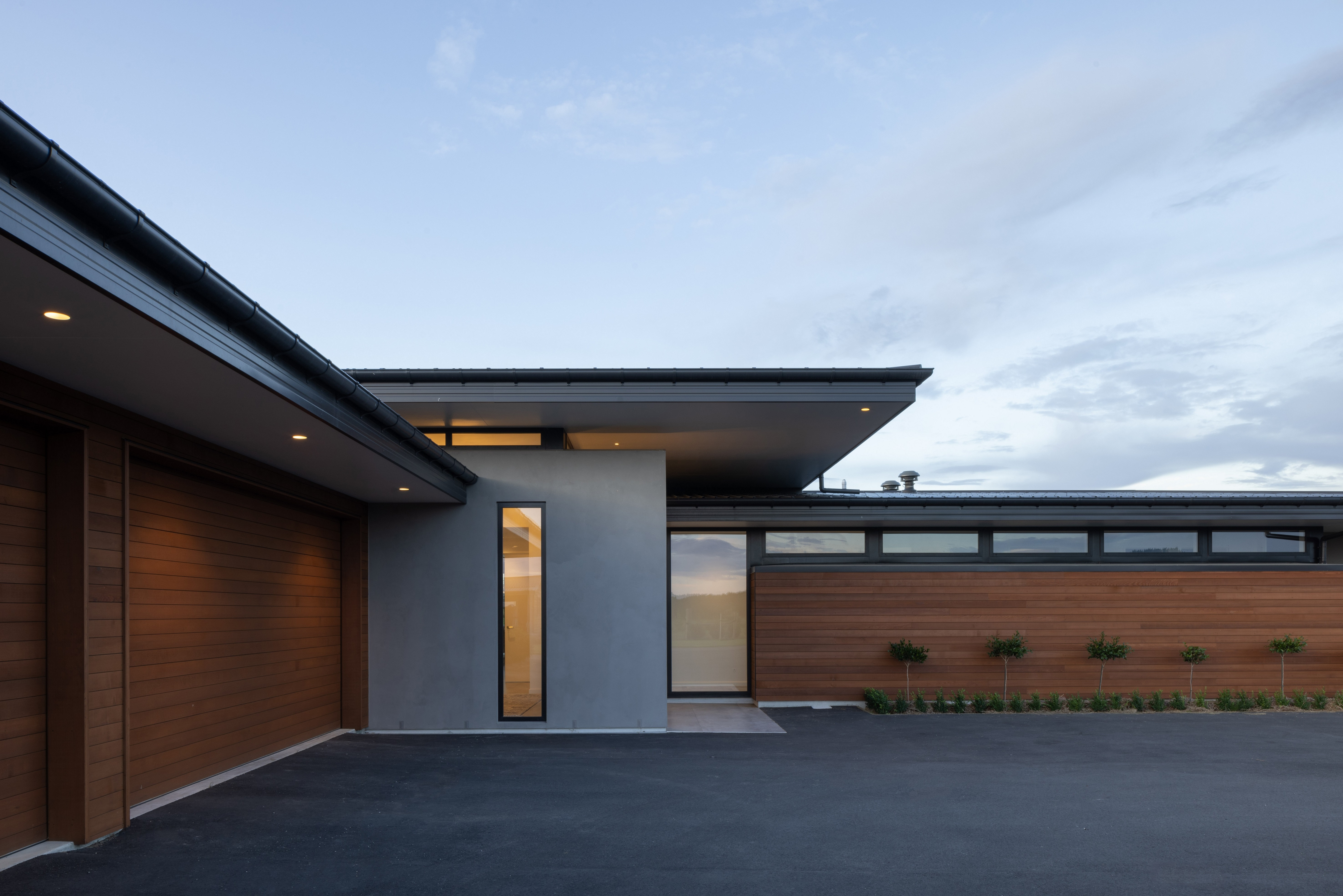 Modern architectural home with outdoor living area built to last by Millar Construction